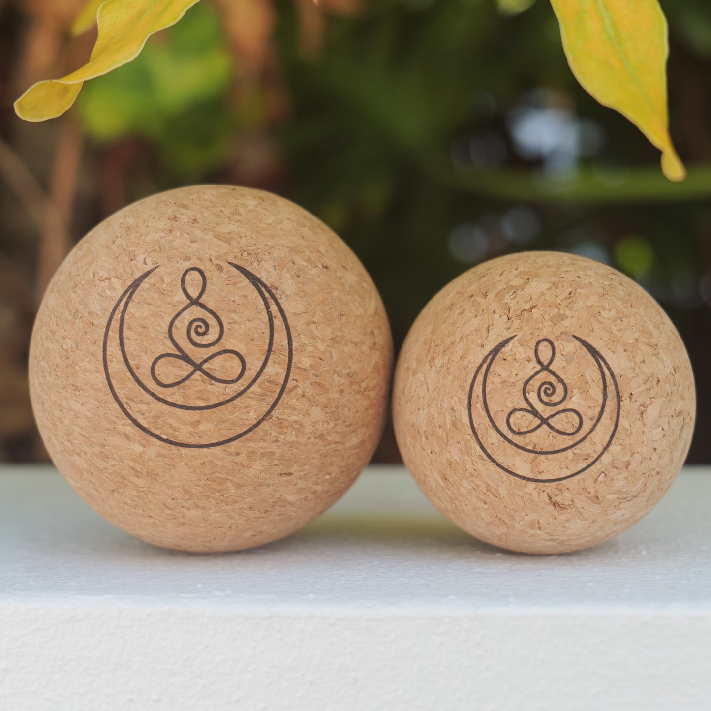 Cork massage balls with OGI NEST logo.