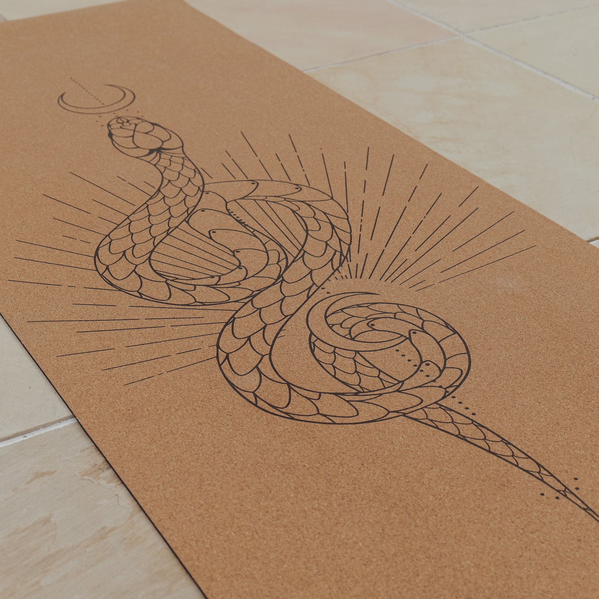 Moon serpent cork and natural rubber yoga mat.